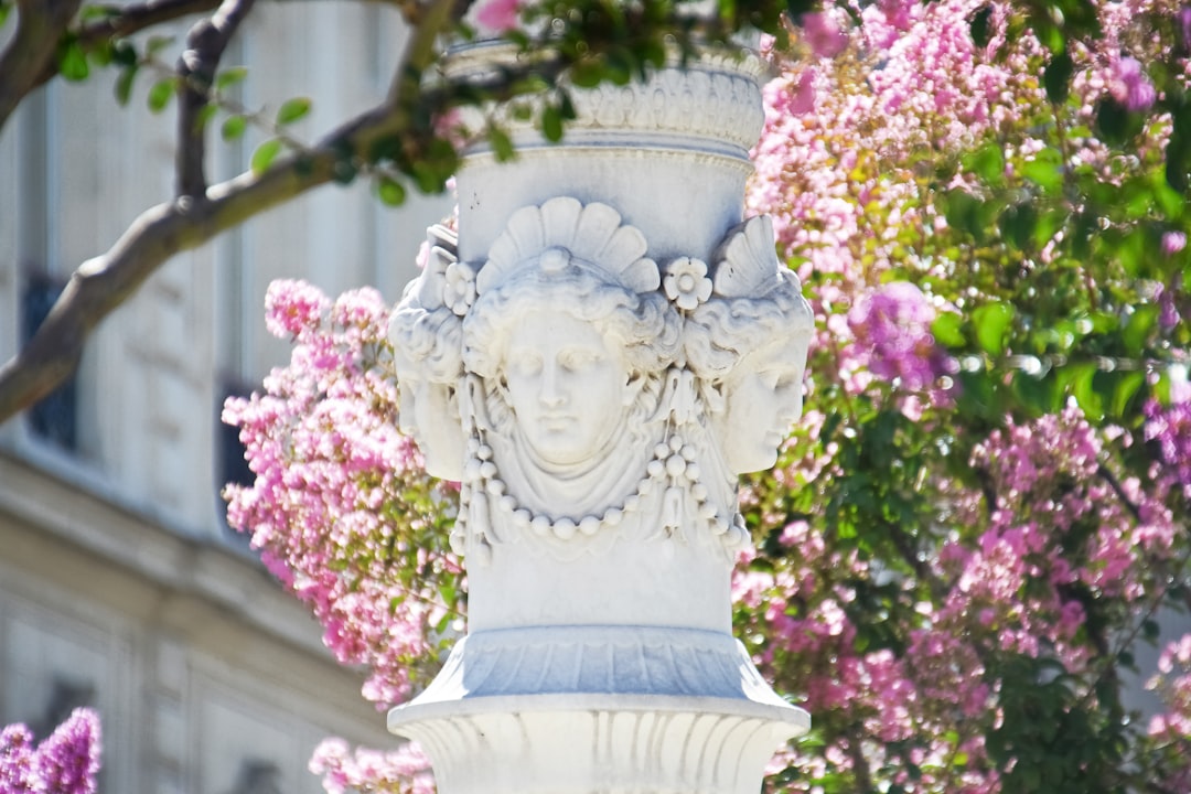 white concrete statue of a woman