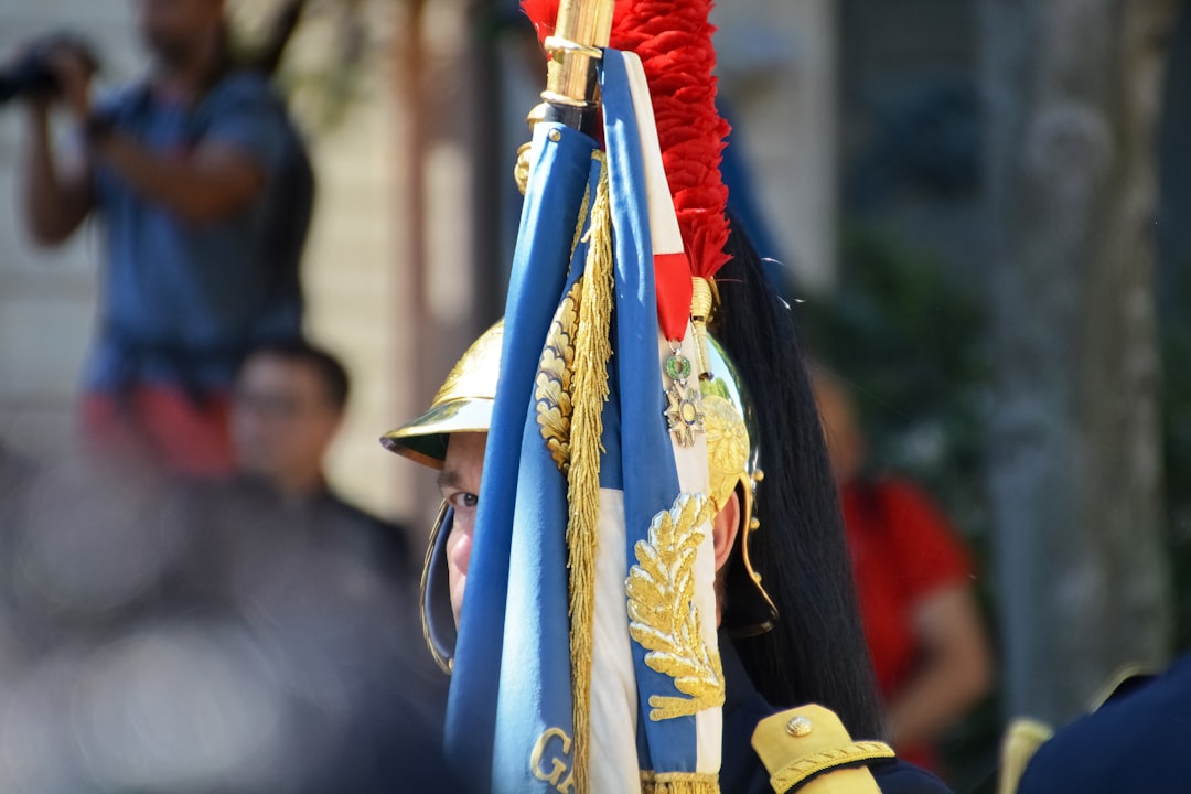 man in blue and gold traditional dress