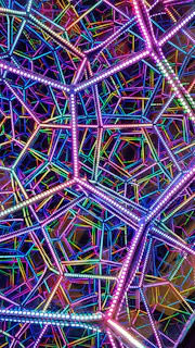 An artful arrangement of LED strips creating a glowing geometric pattern with subtle sparkling overlays.