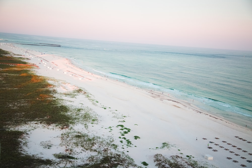 white sand beach during daytime