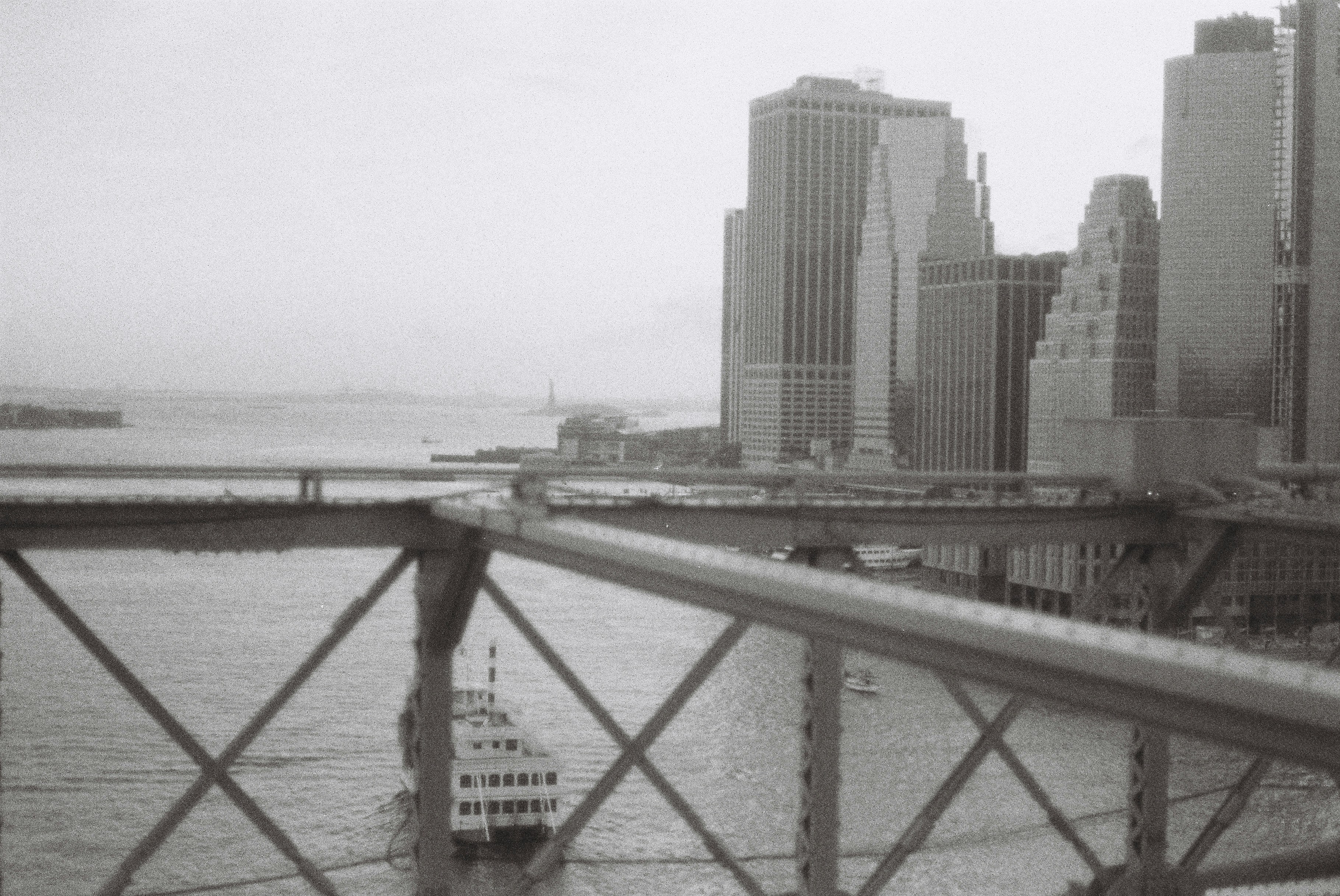 white and brown concrete building near body of water during daytime