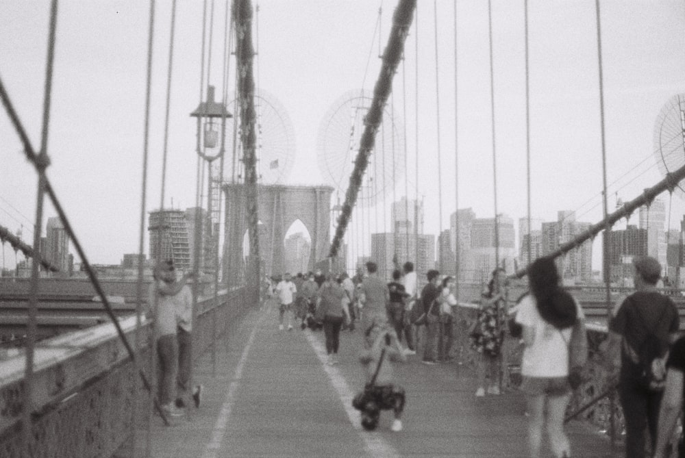 people walking on bridge during daytime