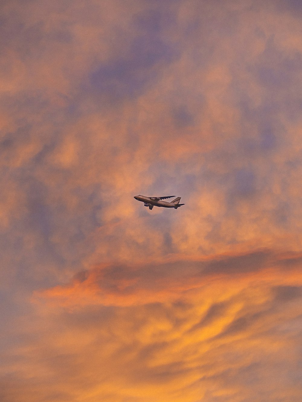 white and black airplane flying in the sky