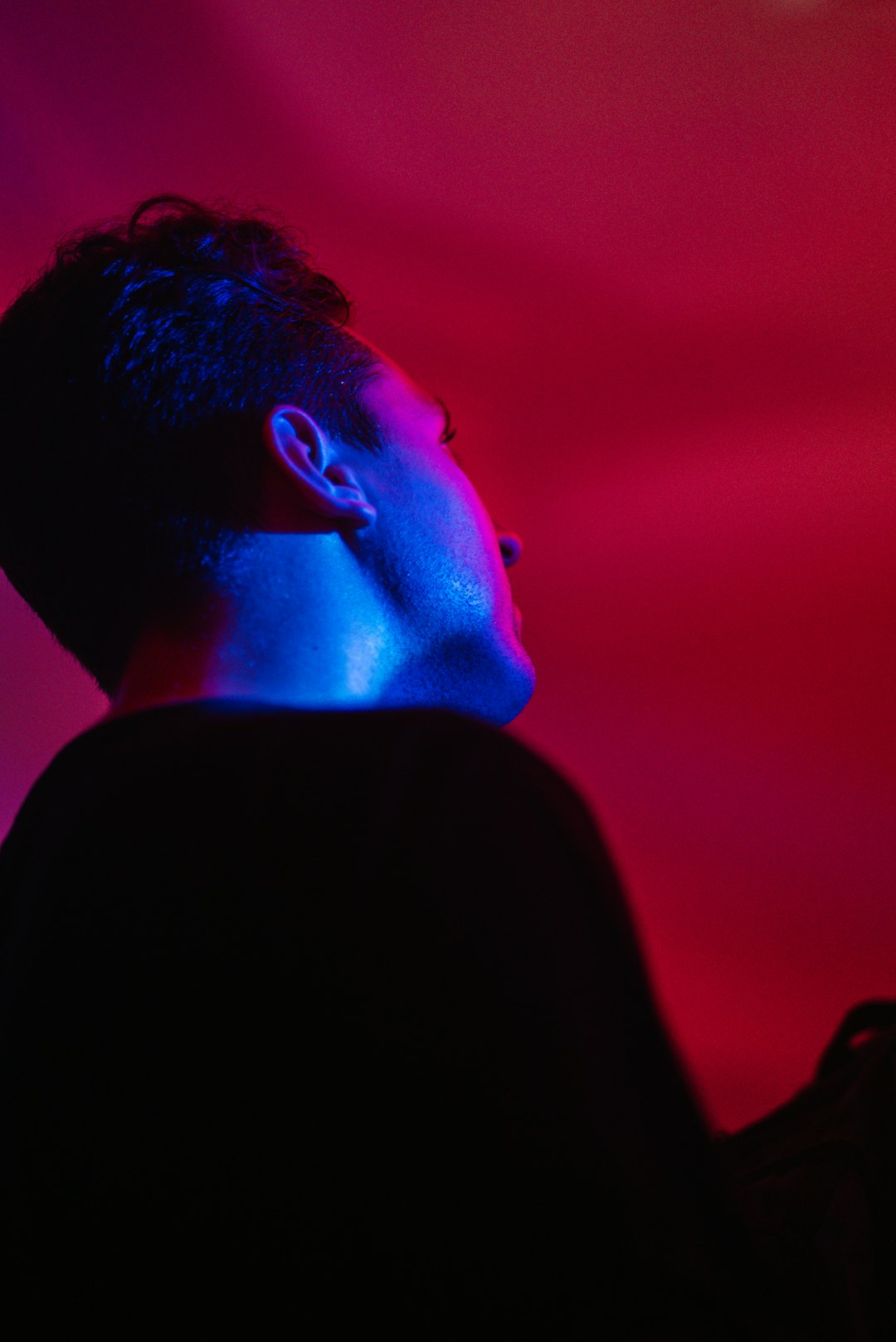 man in black shirt with blue and red lights on his head