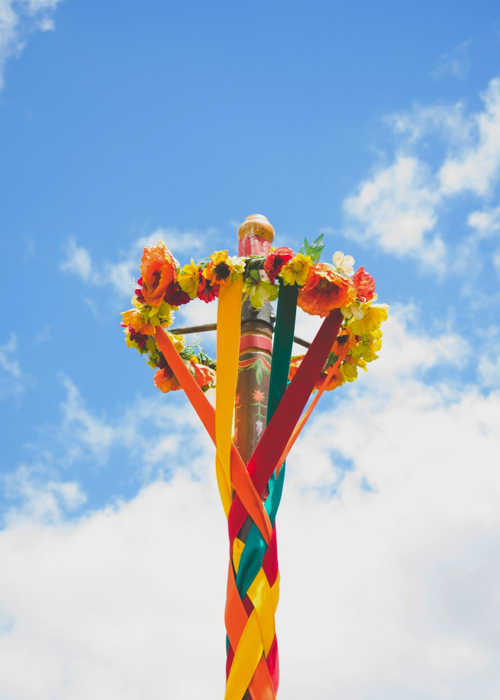 white red and green striped flag under blue sky during daytime