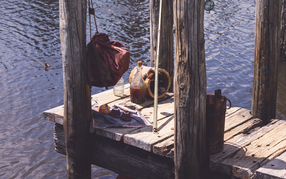 brown wooden dock on body of water during daytime