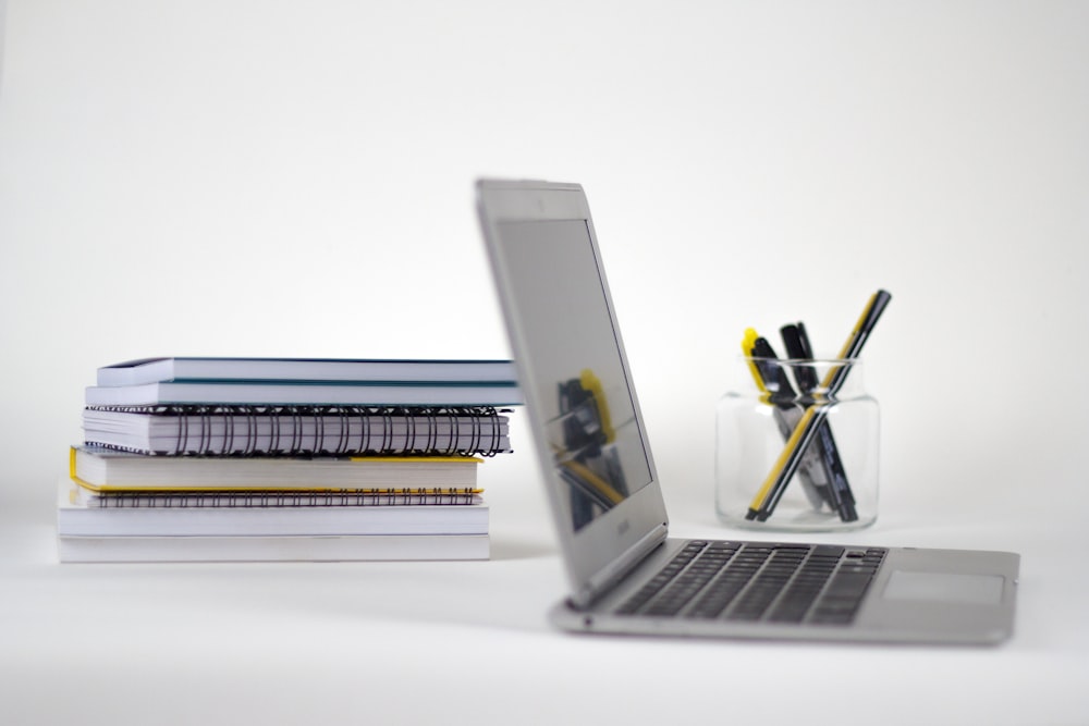 macbook pro on white table