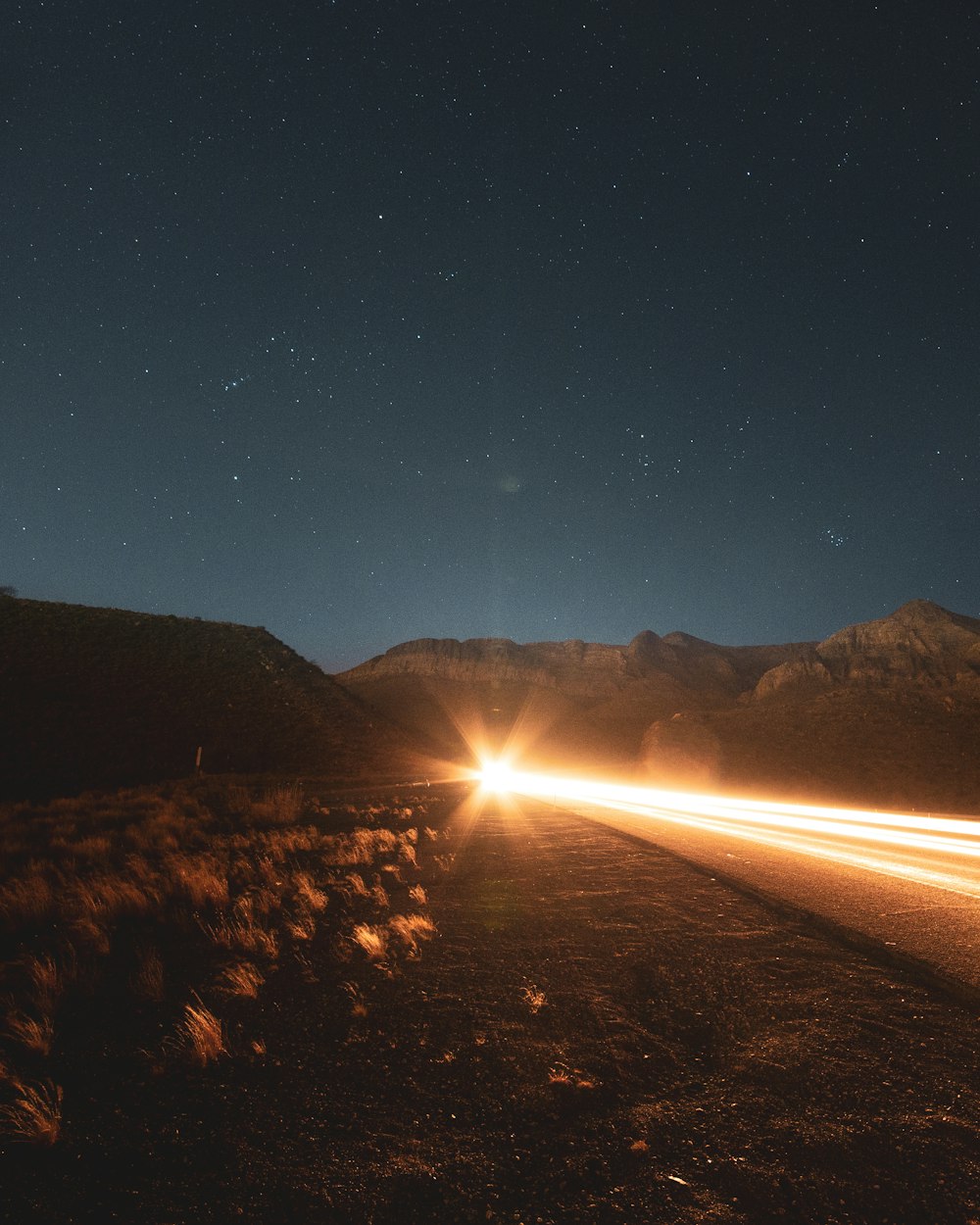 silhouette of mountain during night time