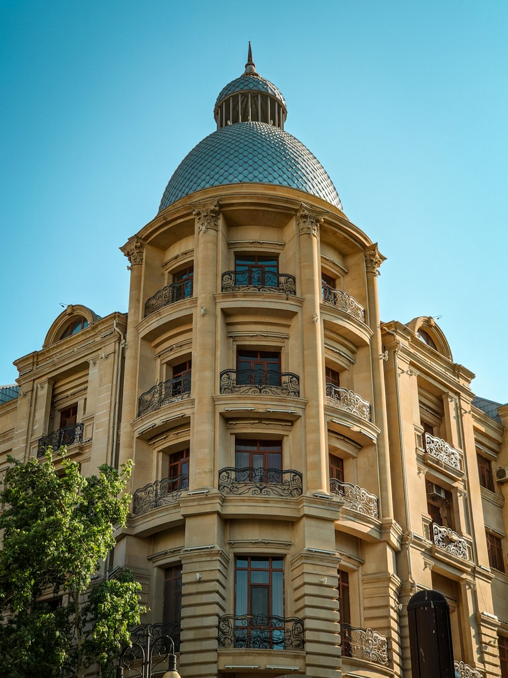 brown concrete building under blue sky during daytime