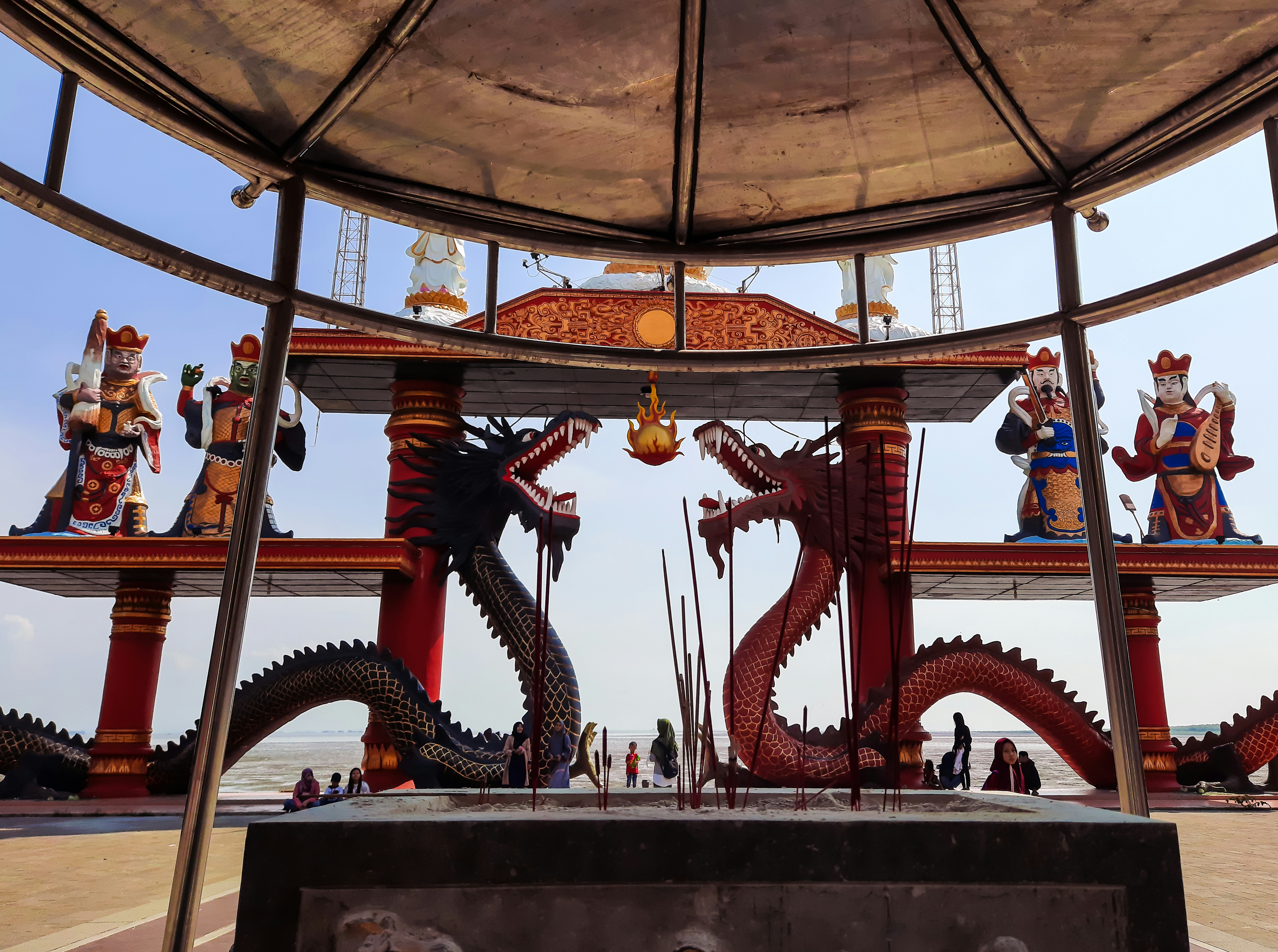 gold and red dragon on black wooden shelf