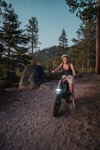 woman in black tank top riding on motorcycle