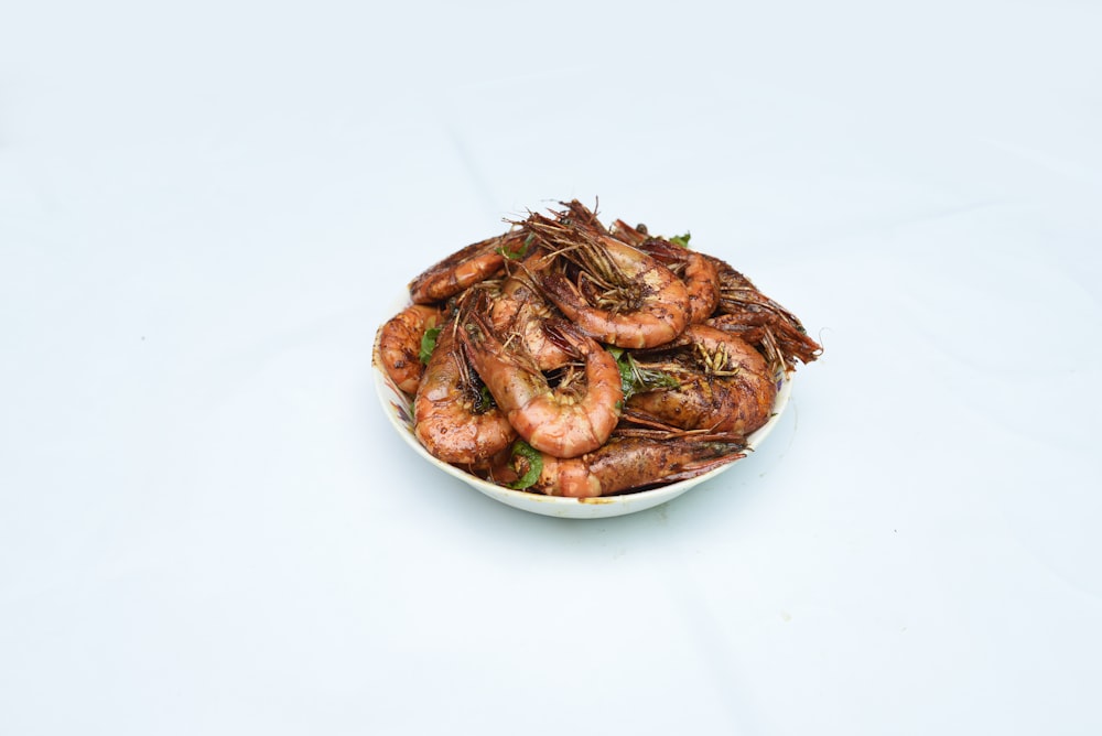 cooked shrimp on white ceramic plate