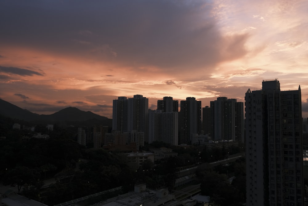 silhouette of city buildings during sunset