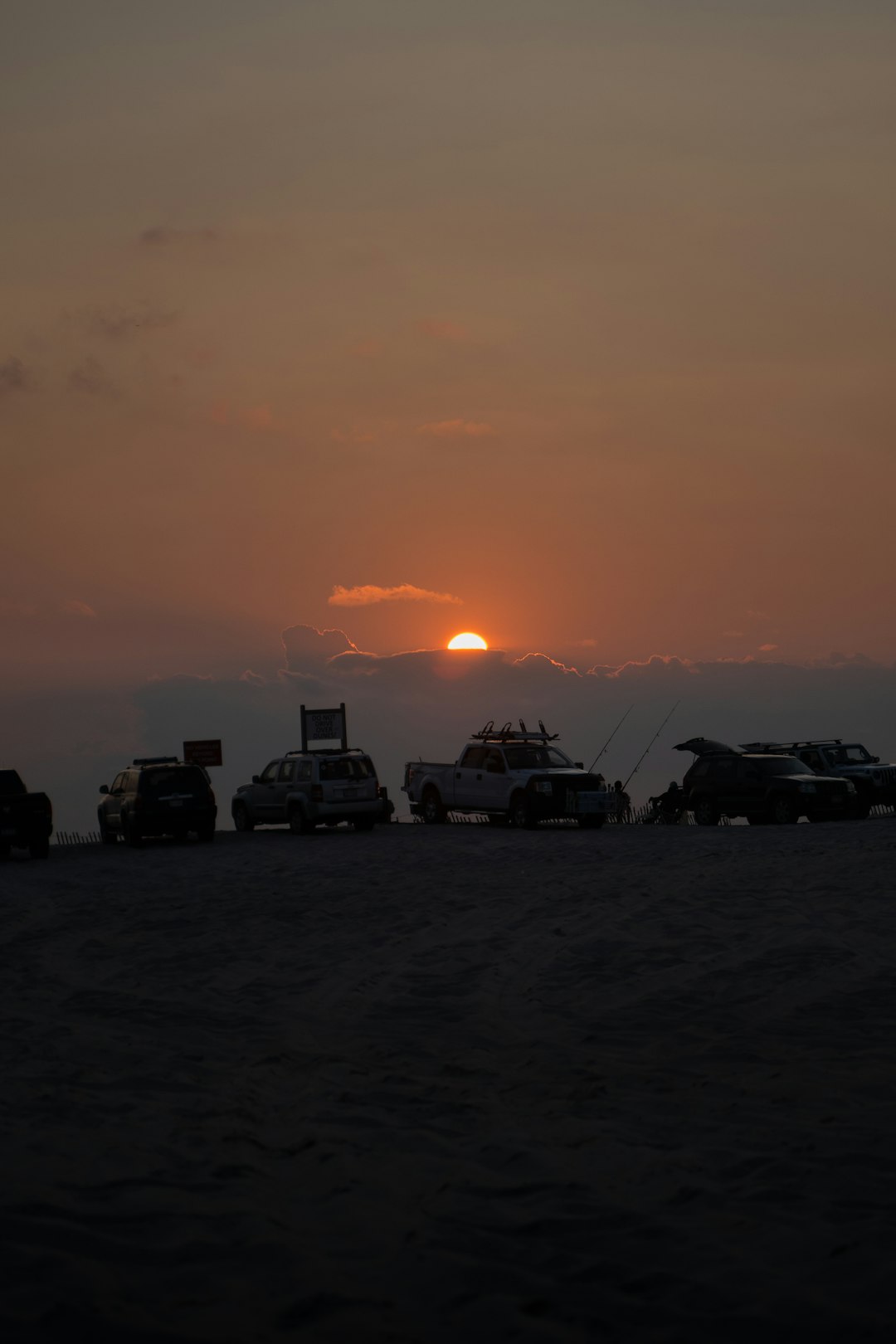 silhouette of cars during sunset