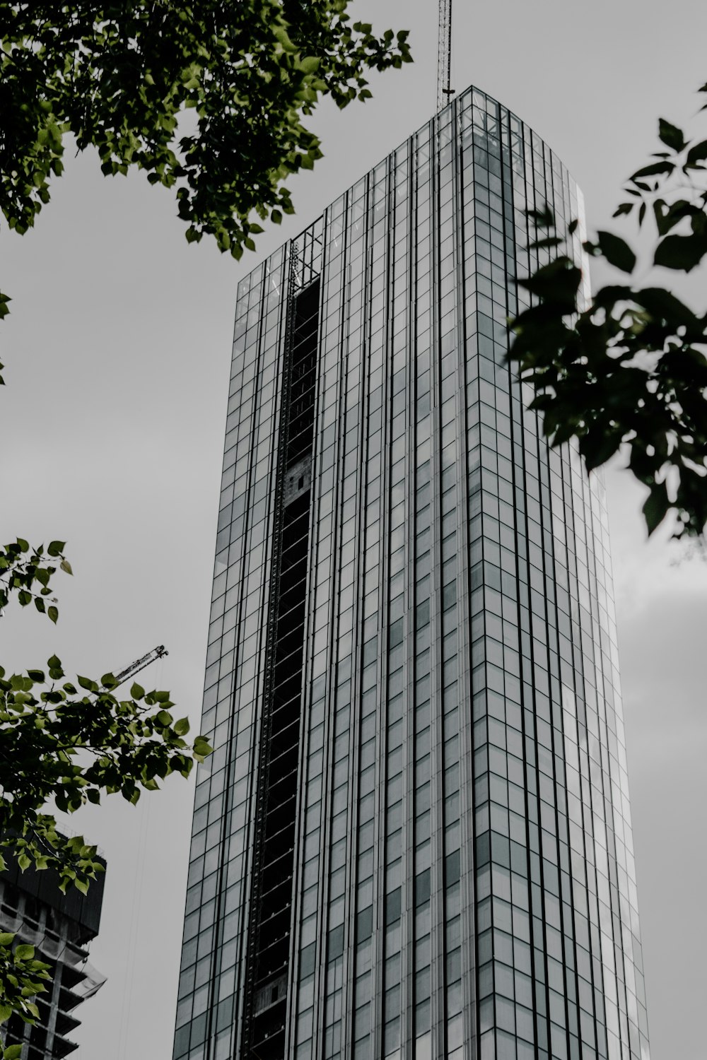 gray concrete building under white clouds during daytime