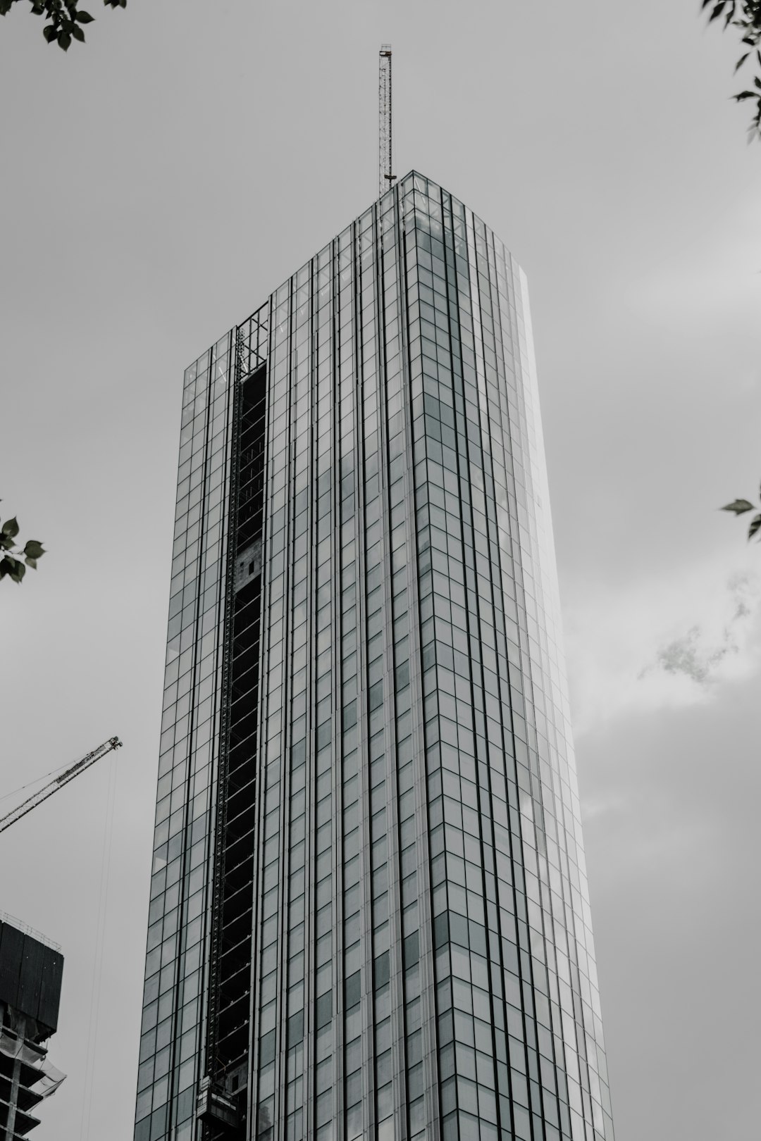 white and blue concrete building under gray sky