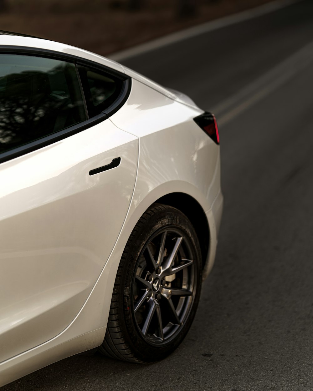 white car on gray asphalt road