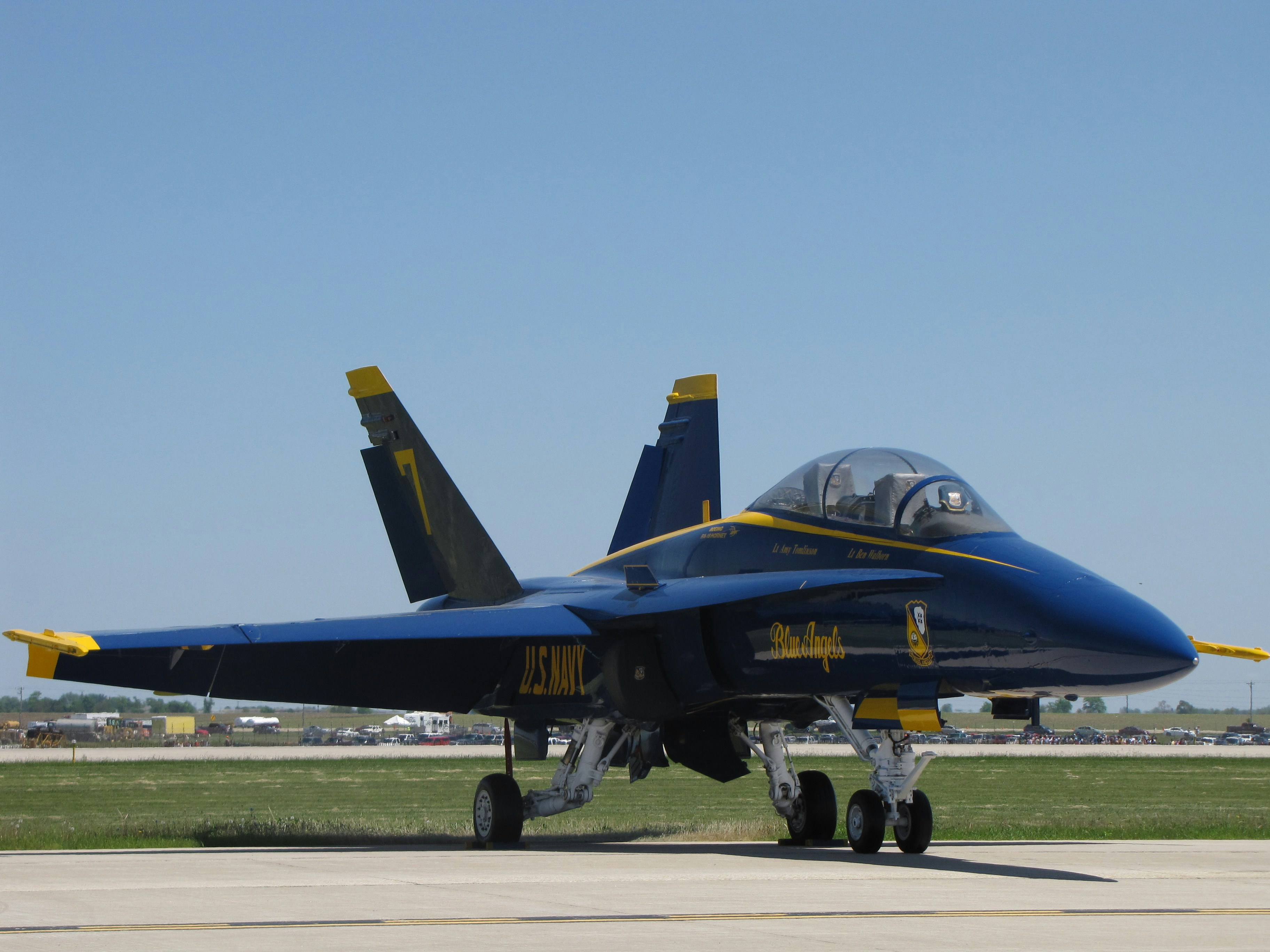 black and yellow jet plane on gray concrete ground during daytime