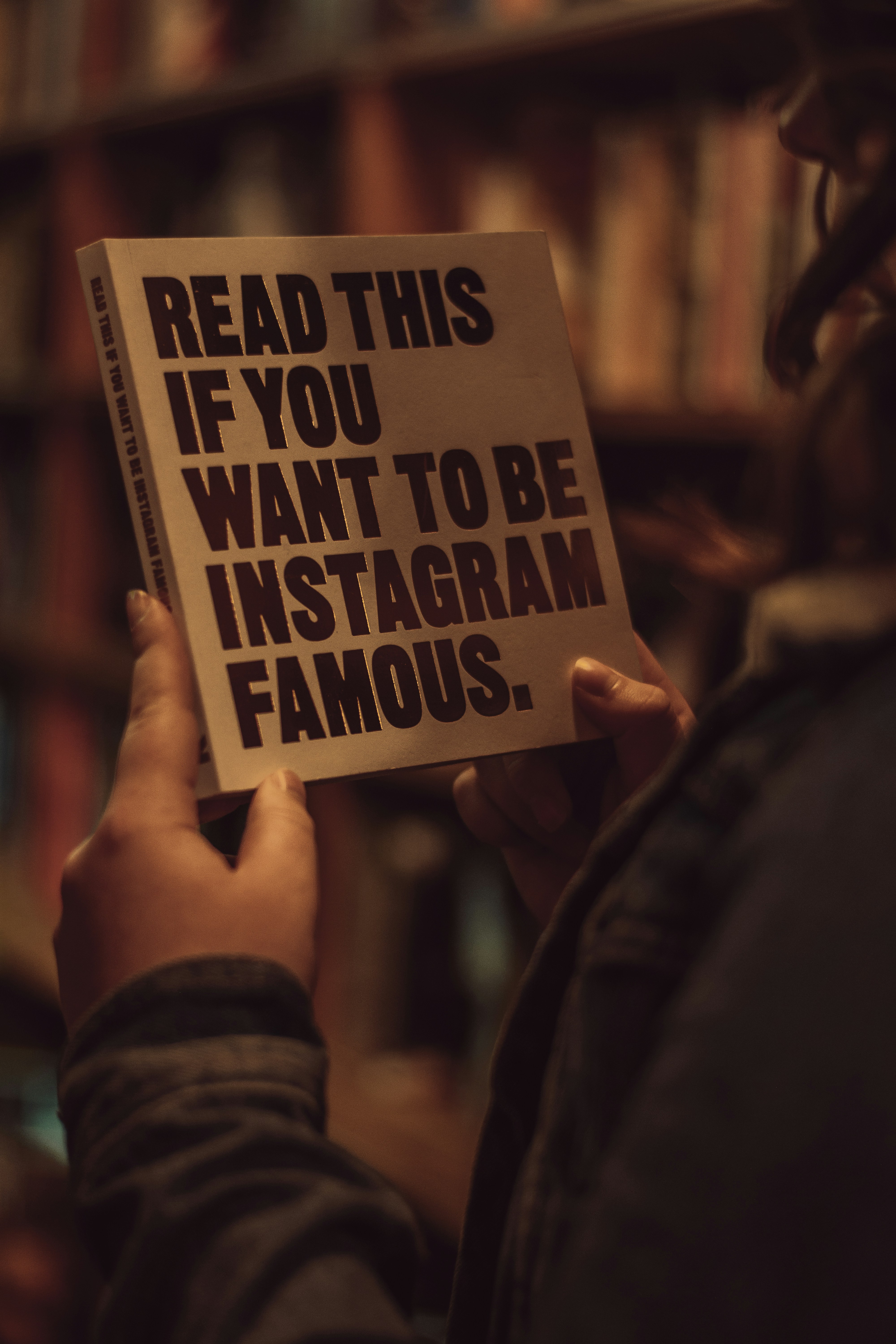 person holding white and black quote board