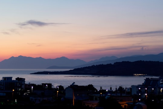 silhouette of mountain near body of water during sunset in Ksamil Albania