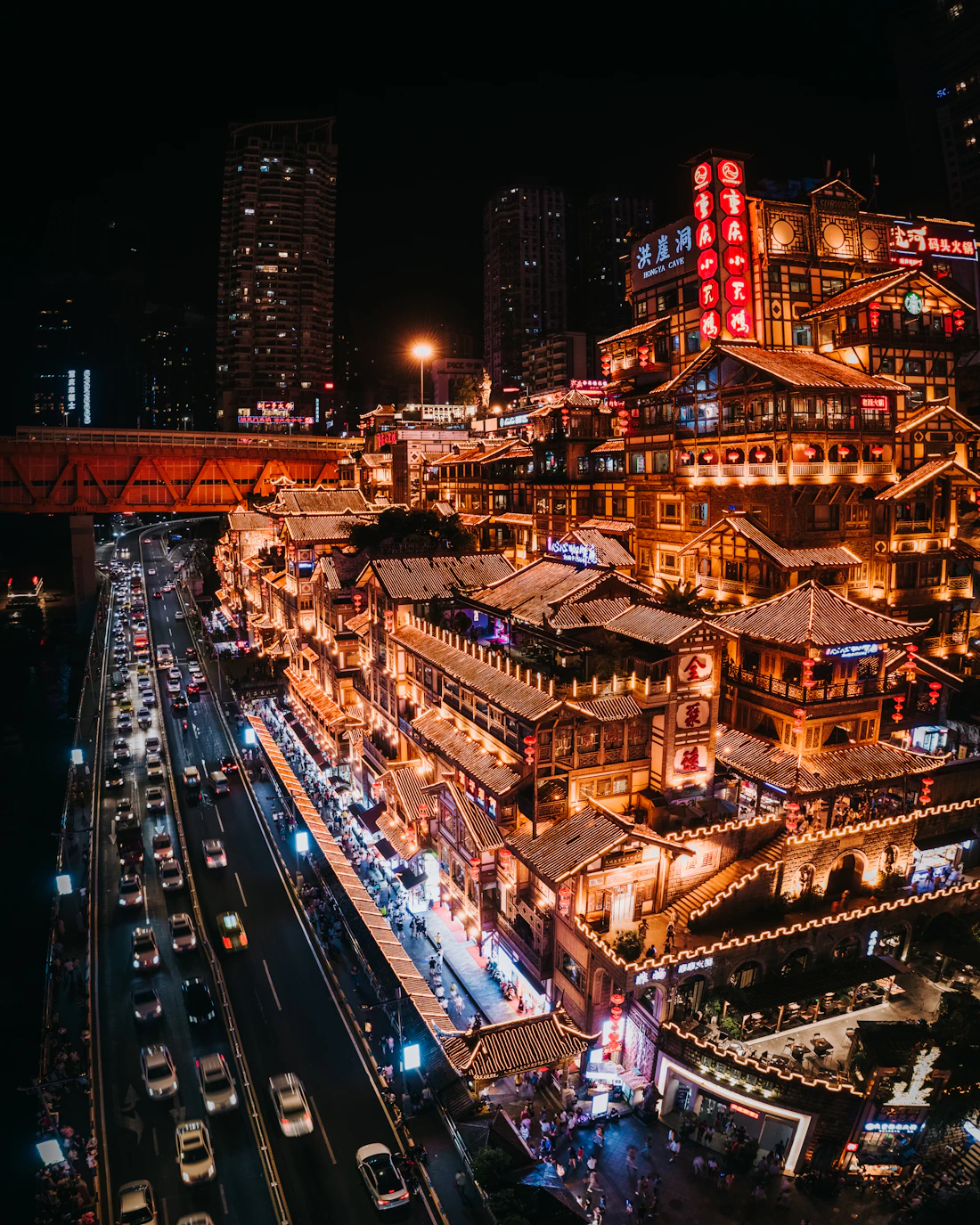 A lantern-lit historic street in Chongqing at night with traditional architecture