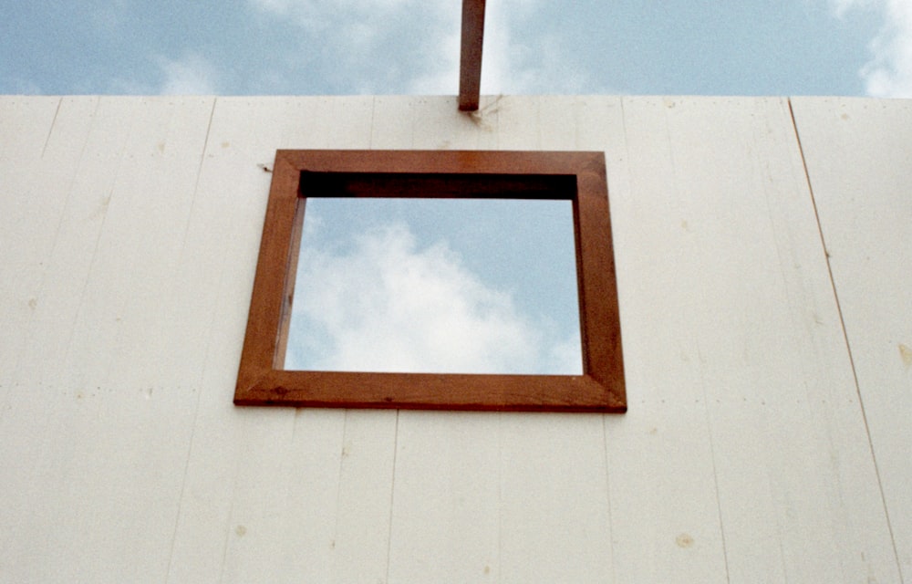 a square window on the side of a building