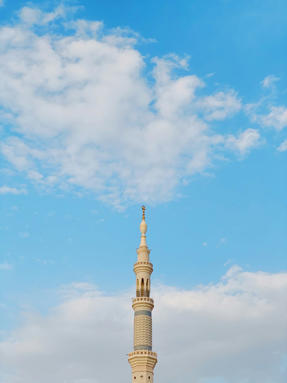 white and brown concrete building under blue sky during daytime