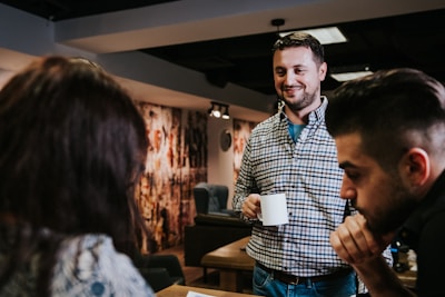 A cozy break area with employees enjoying coffee and conversation.