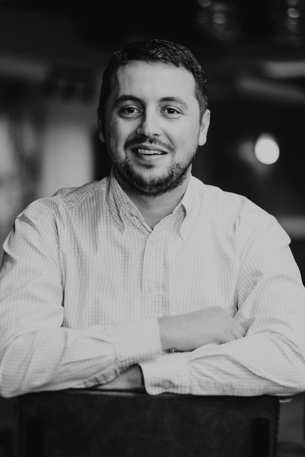 man in white dress shirt smiling