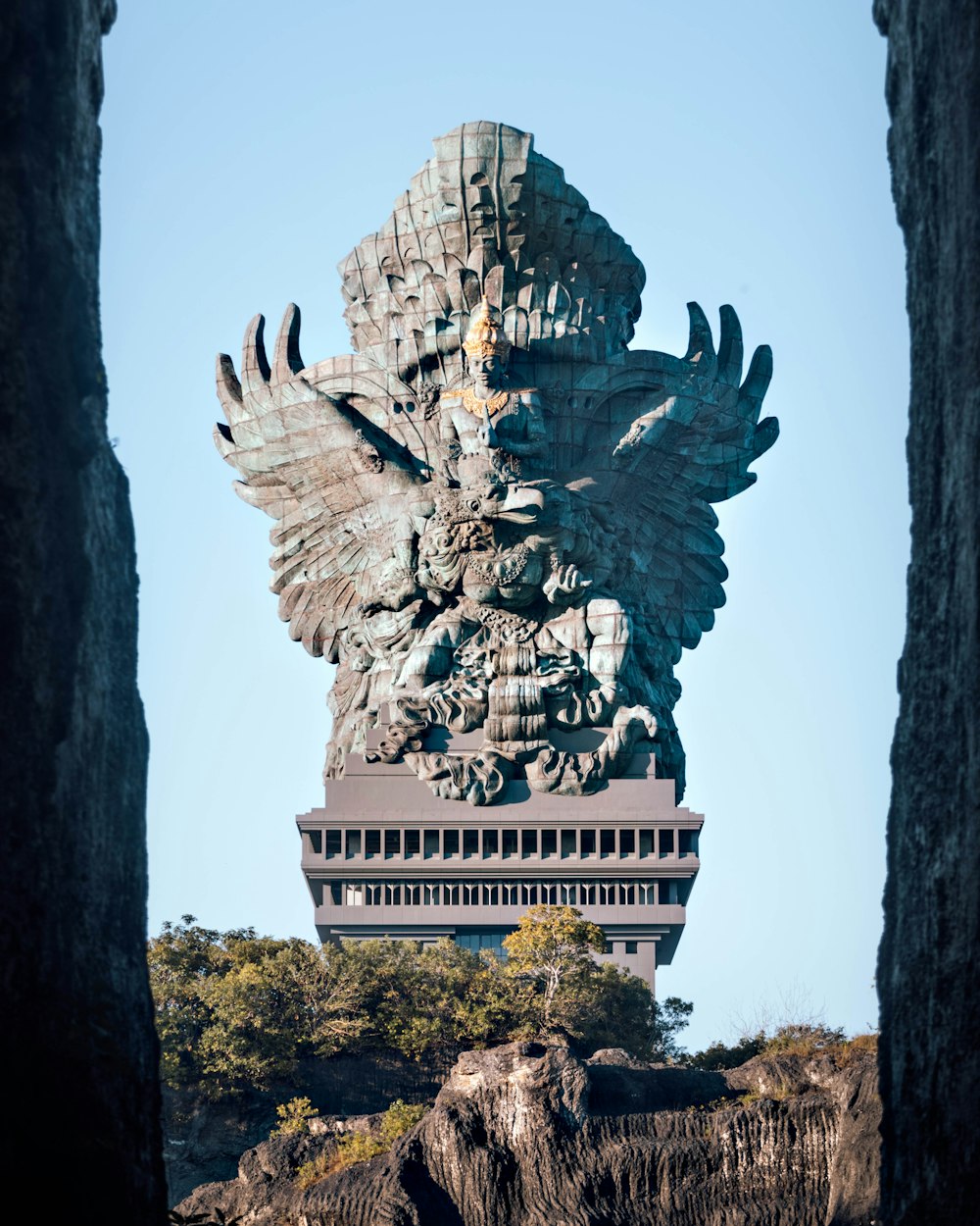 gray concrete statue under blue sky during daytime