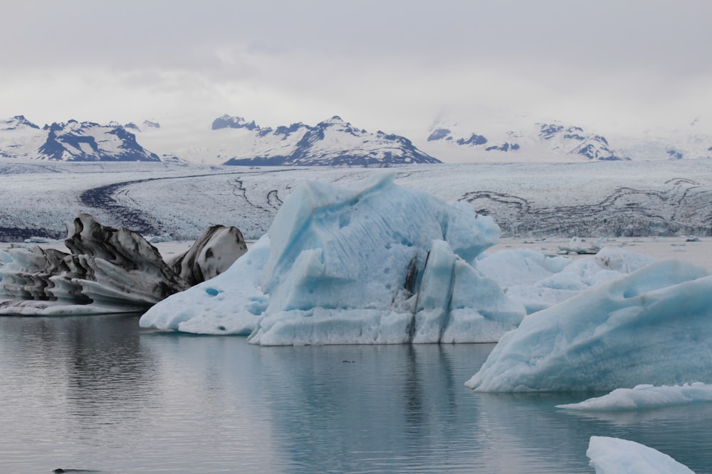 white ice on body of water during daytime