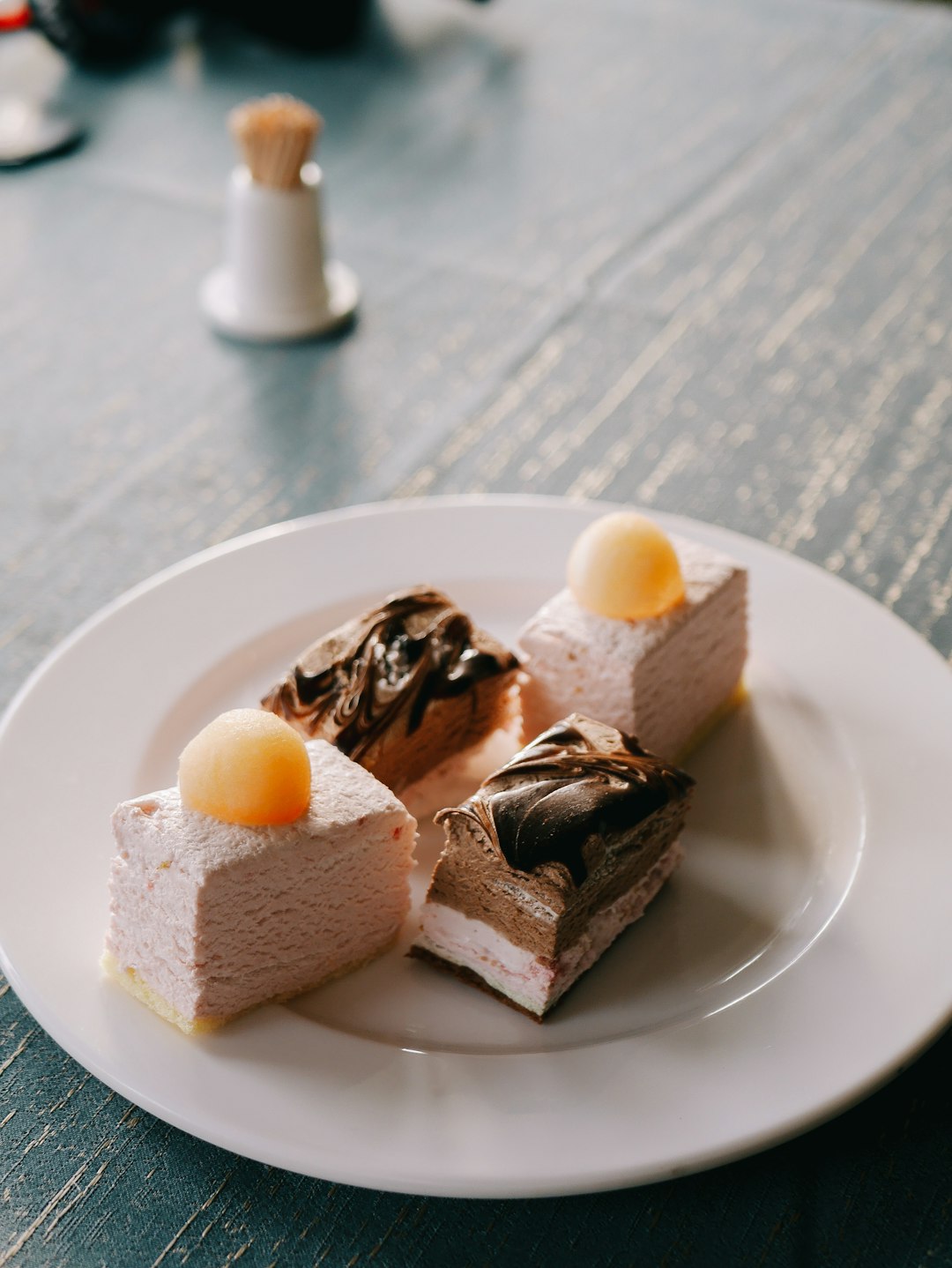 sliced of chocolate cake on white ceramic plate