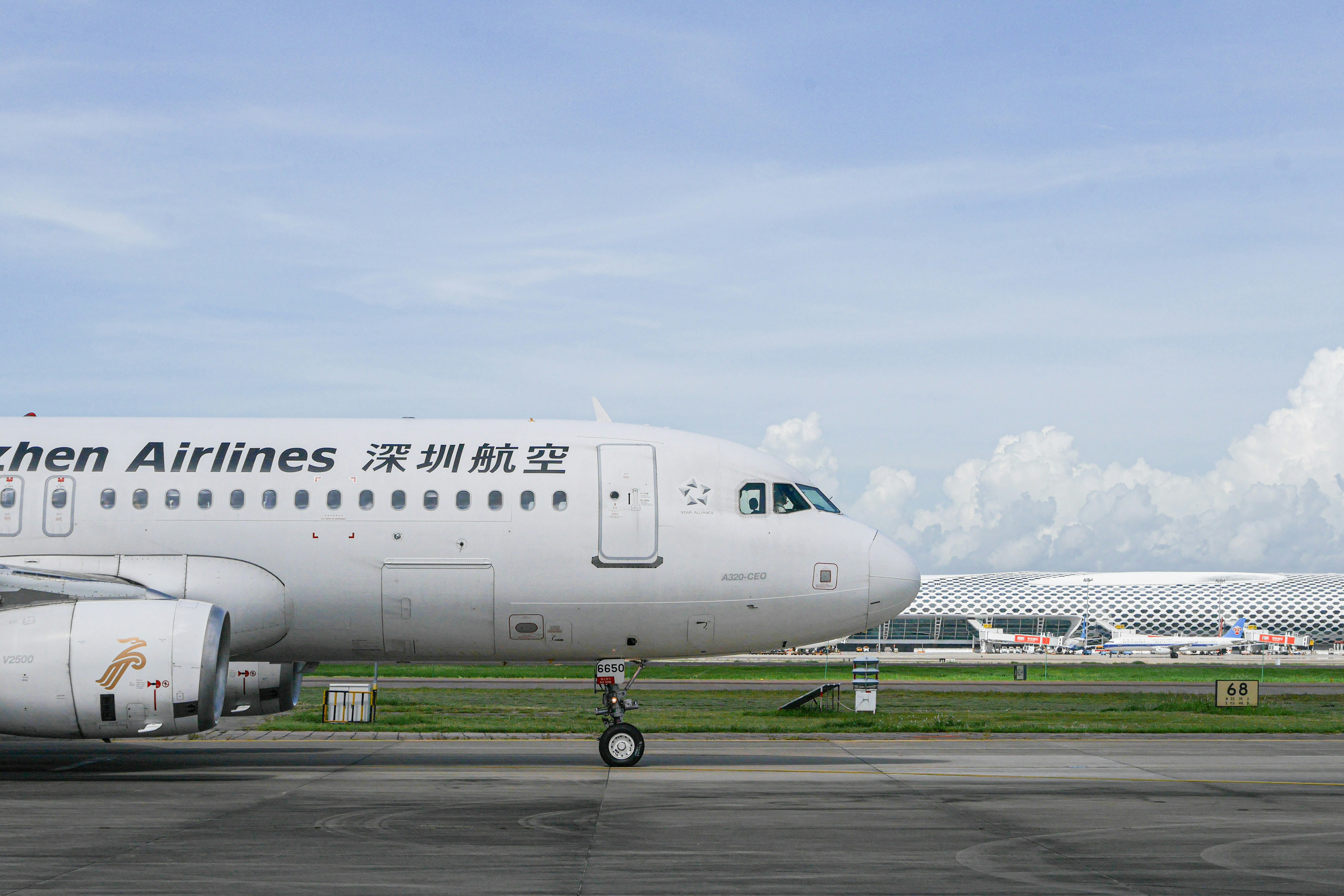 white passenger plane on airport during daytime