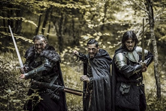 A lively group of members practicing medieval sword fighting in period attire.