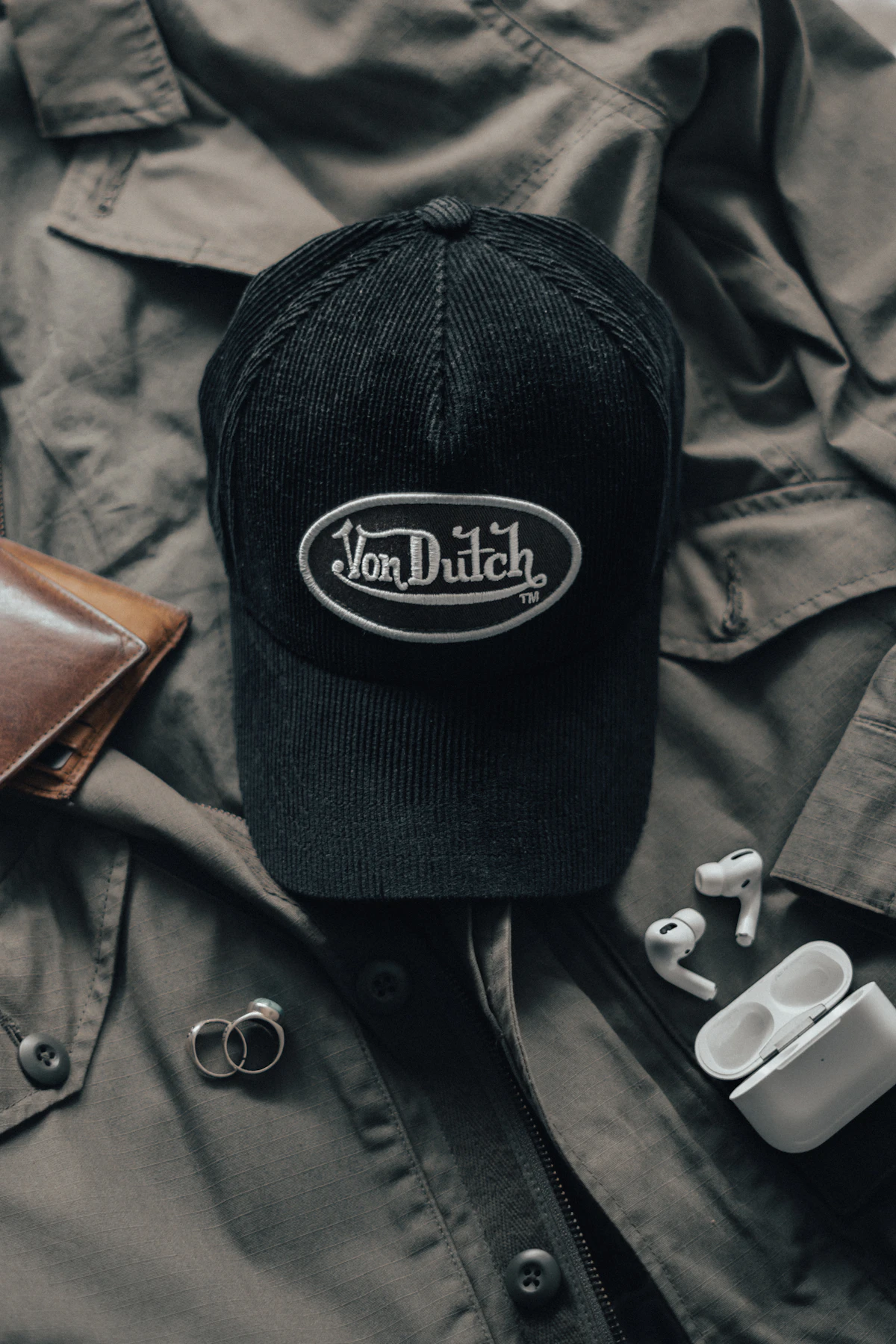 Black cap photographed on dark clothing