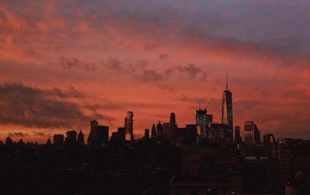 silhouette of city buildings during sunset