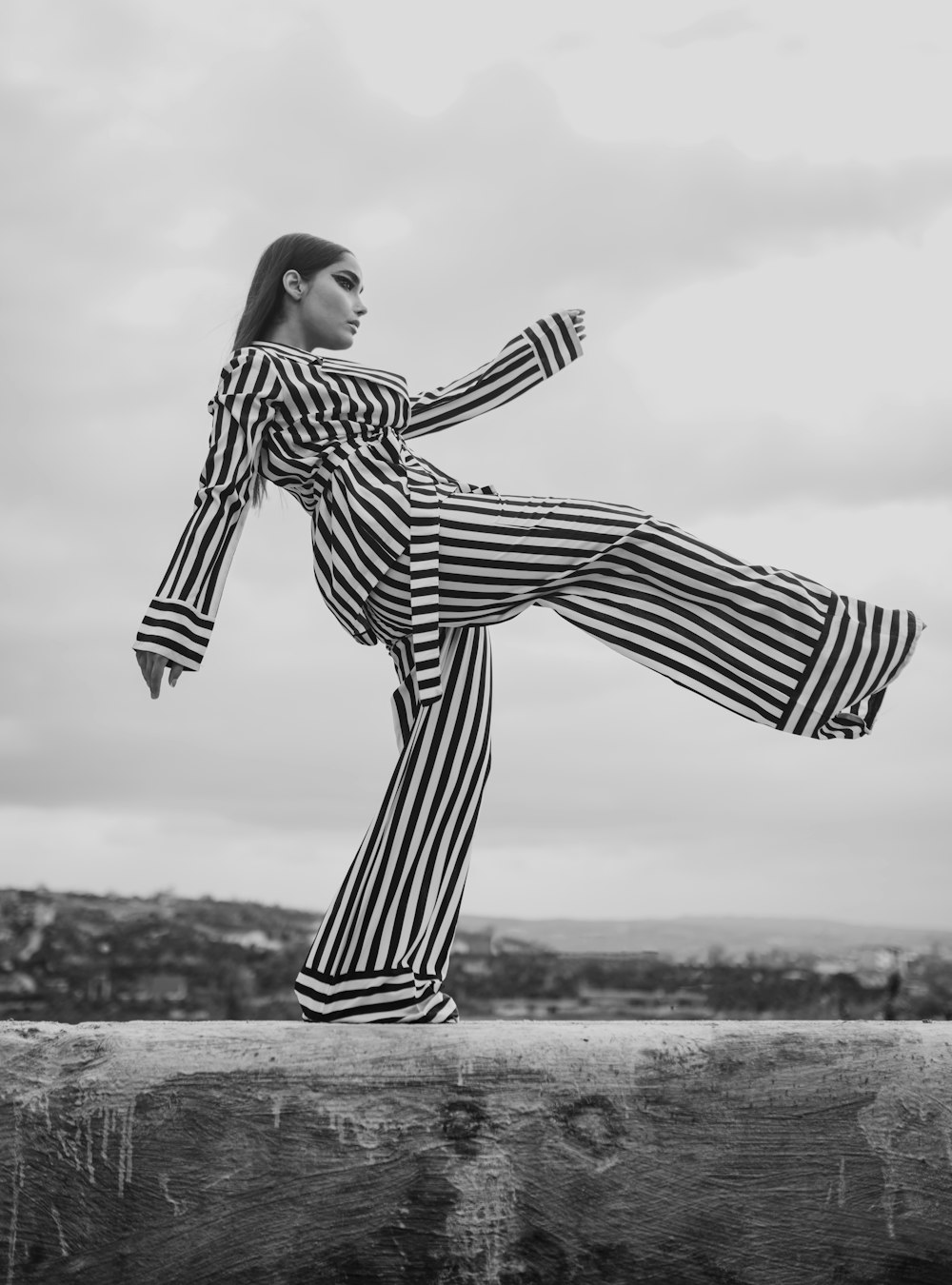 woman in black and white striped long sleeve dress