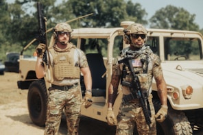 3 men standing beside white car during daytime