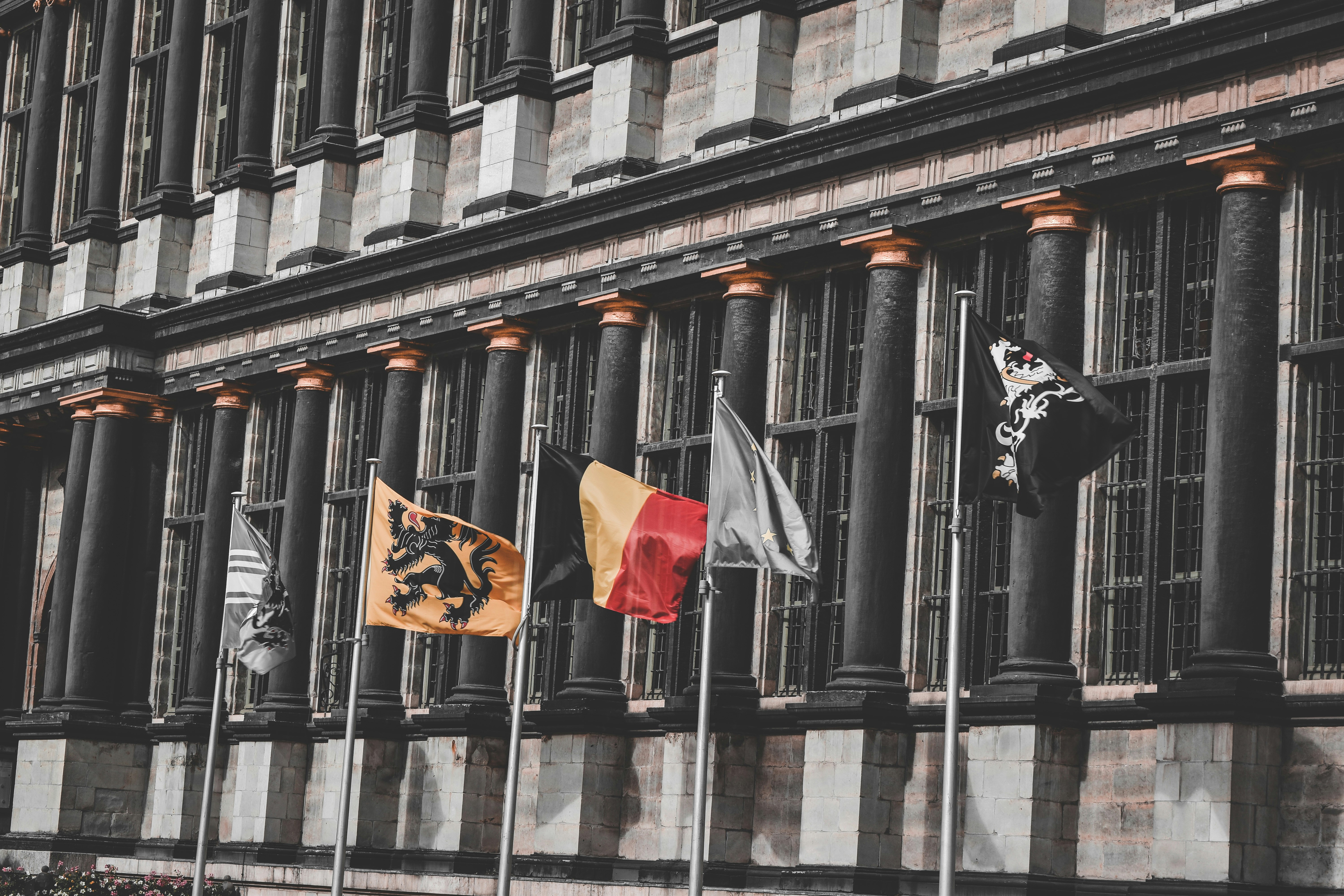 Stately government building with columns and national flag flying