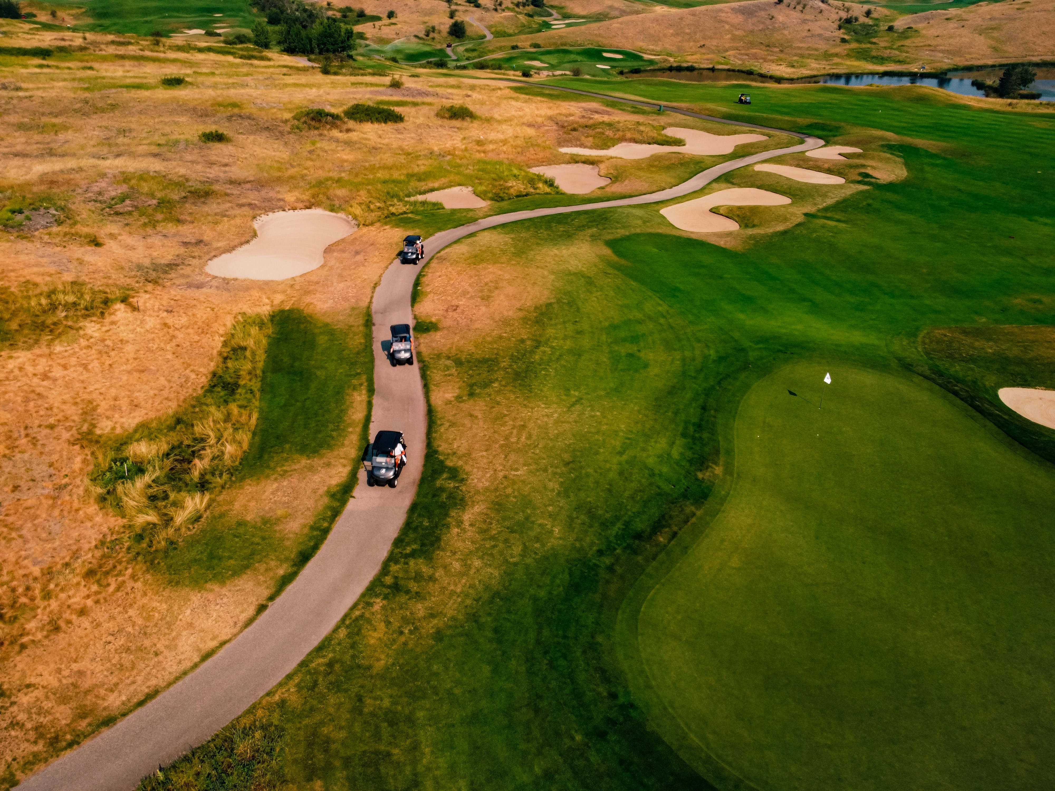 Aerial view of green grass field during daytime photo Free Golf course Image on Unsplash