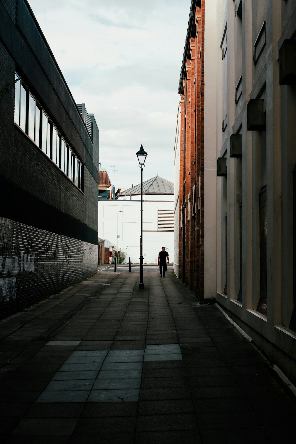 person walking on sidewalk during daytime