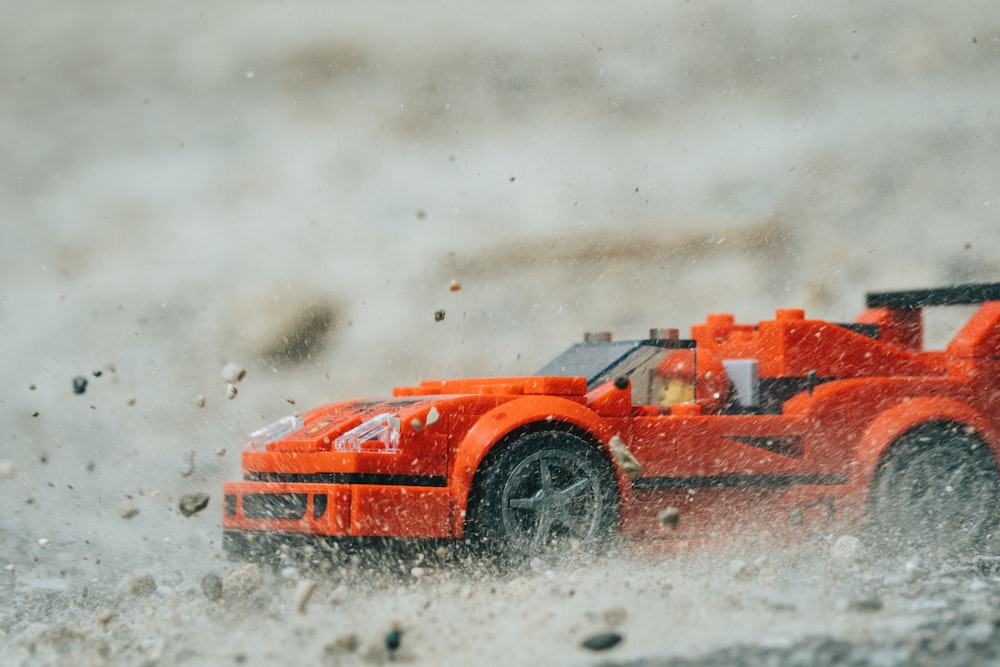 orange ferrari f 1 on water