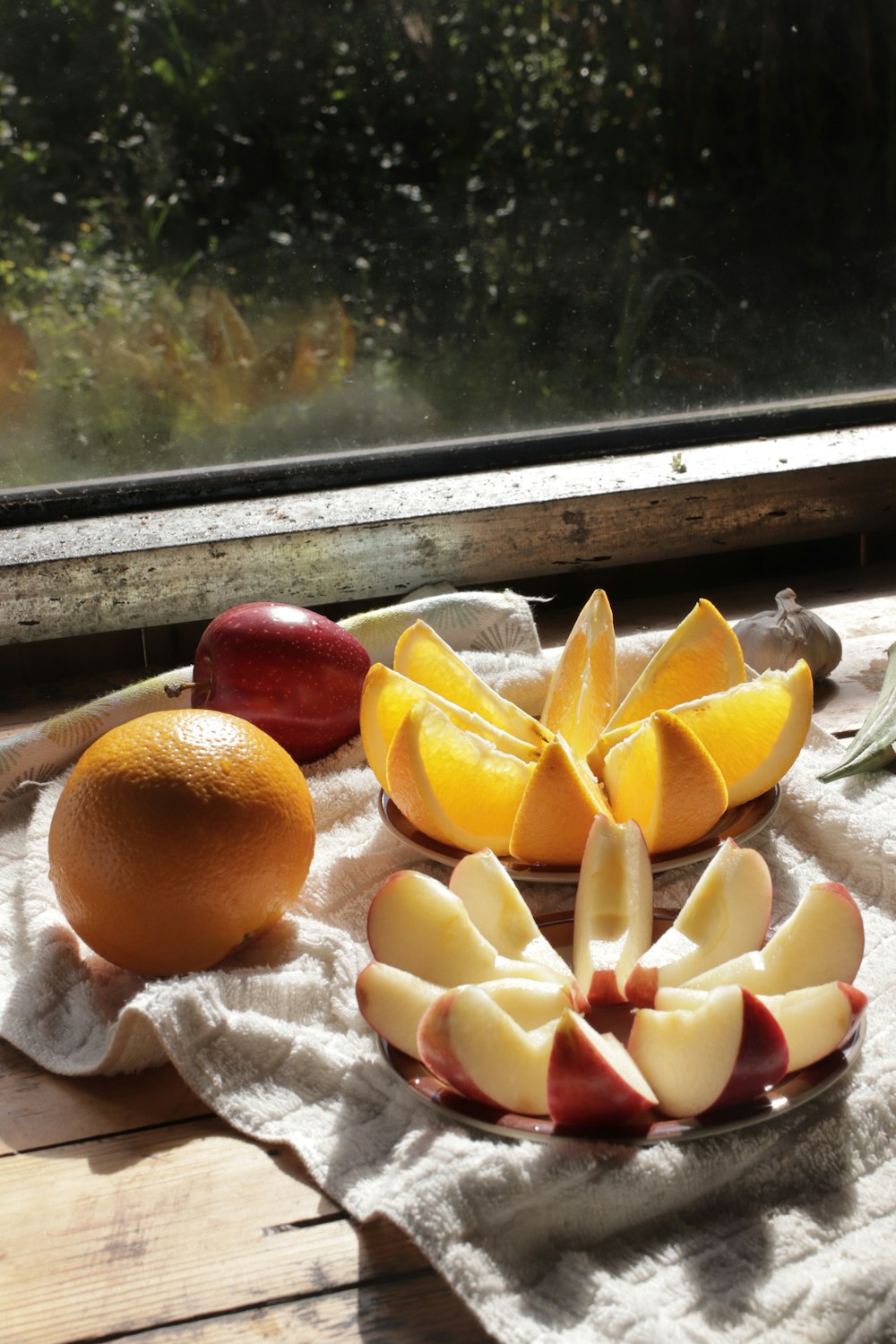 sliced orange fruit on white textile