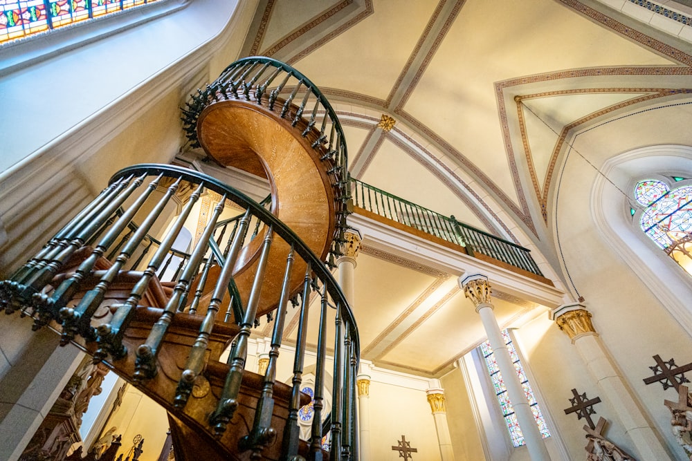 brown wooden spiral staircase inside building