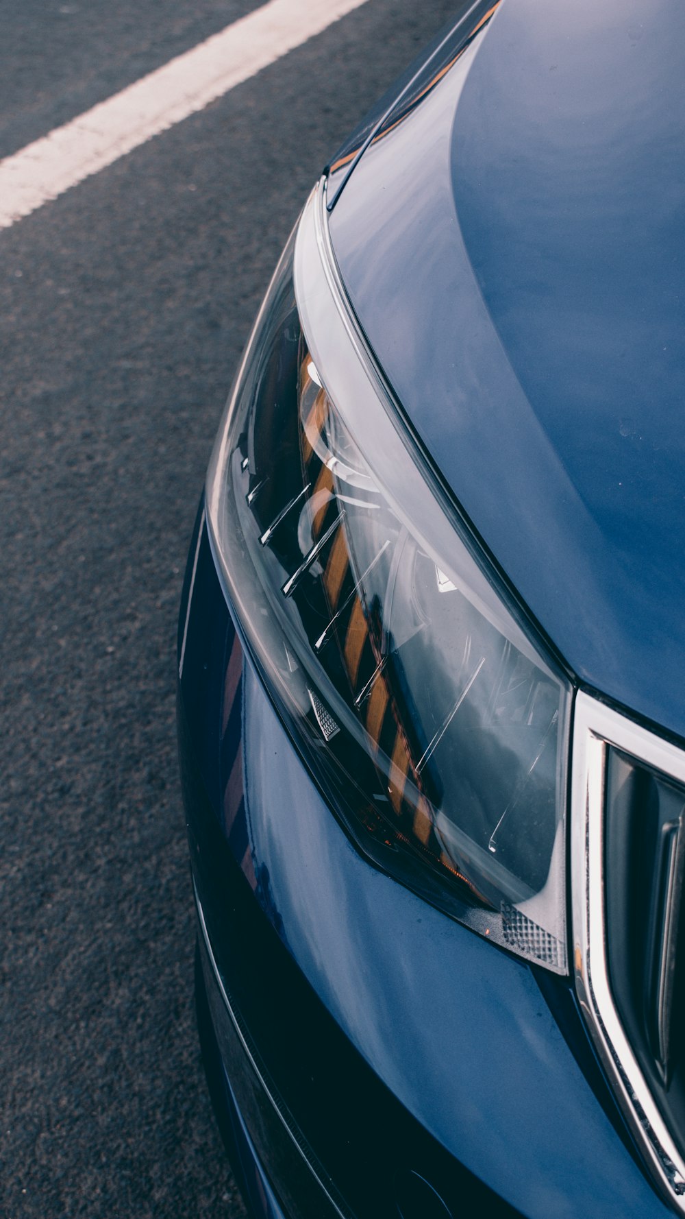 blue car with white and black license plate