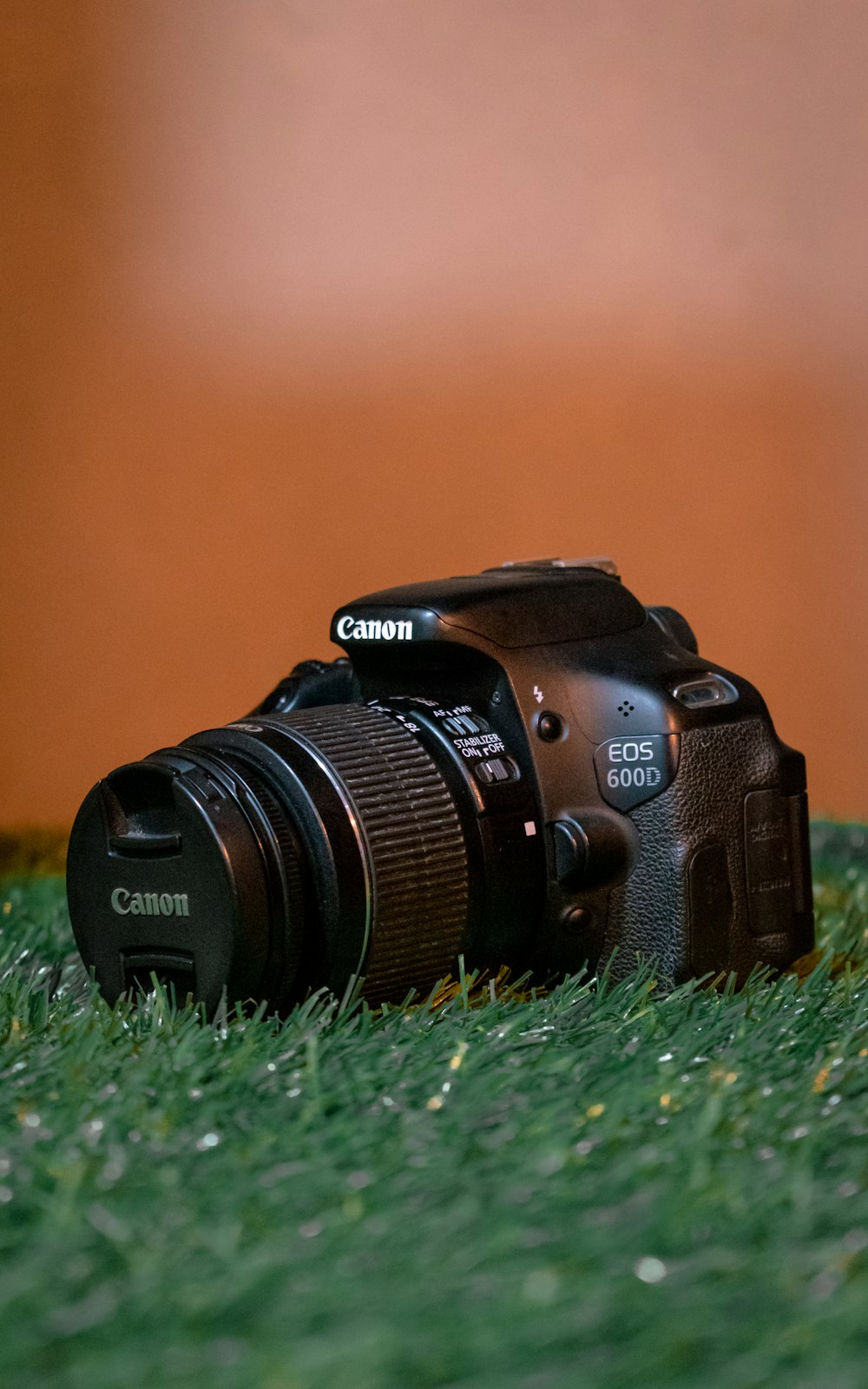 black nikon dslr camera on green grass photo – Free Camera Image on Unsplash