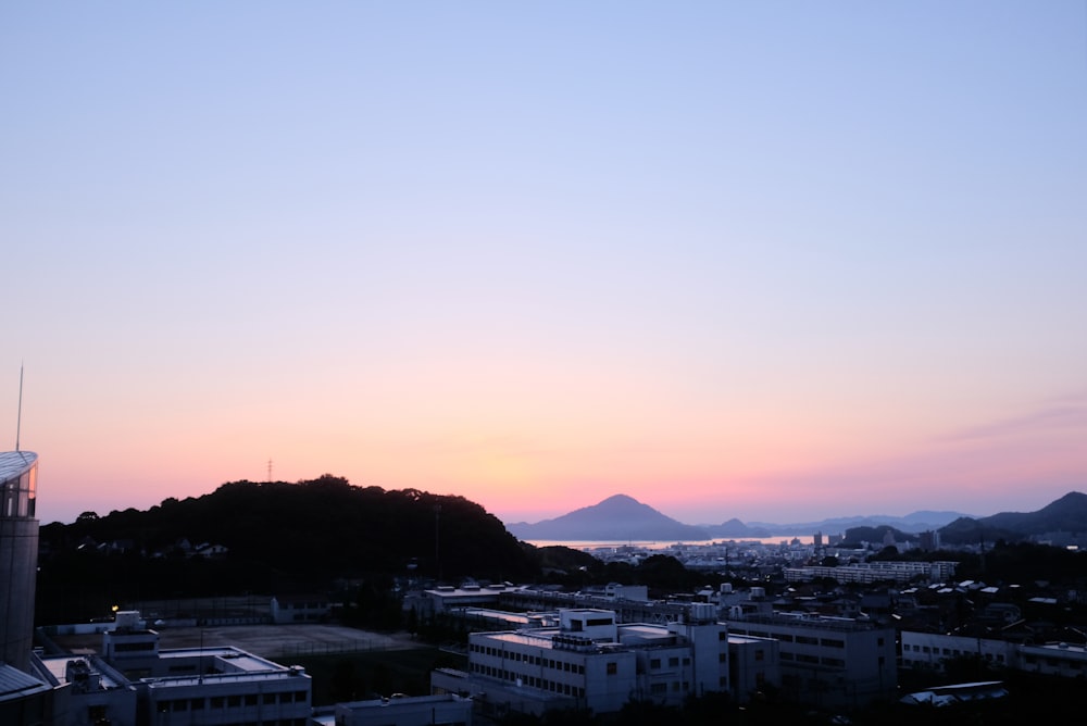 city buildings near mountain during daytime