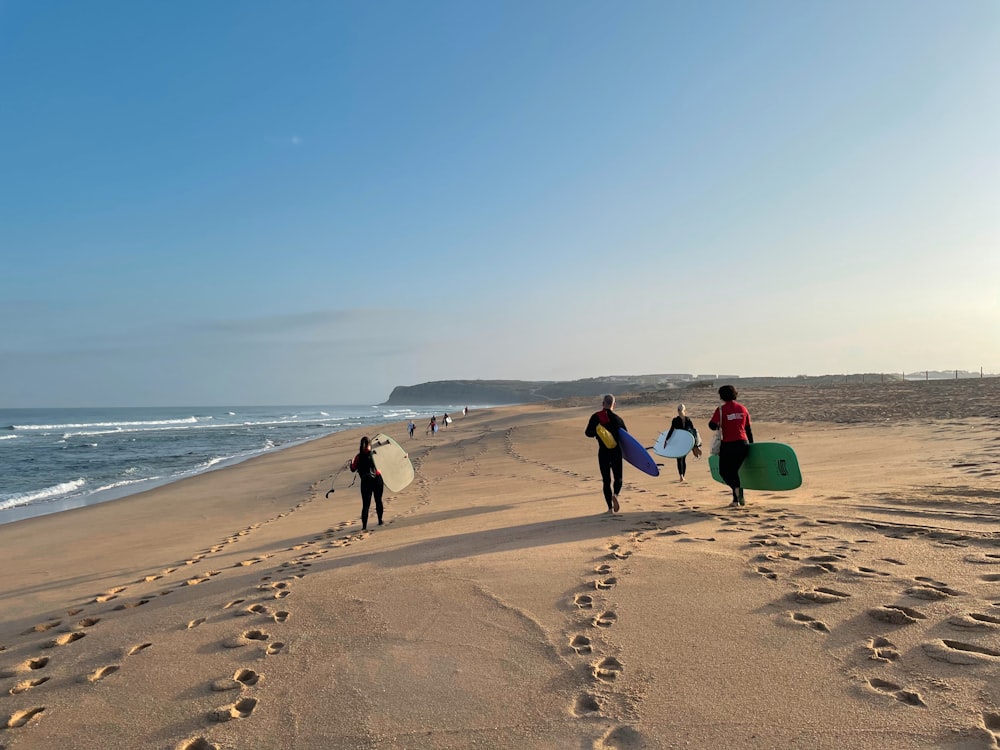 people walking on beach during daytime