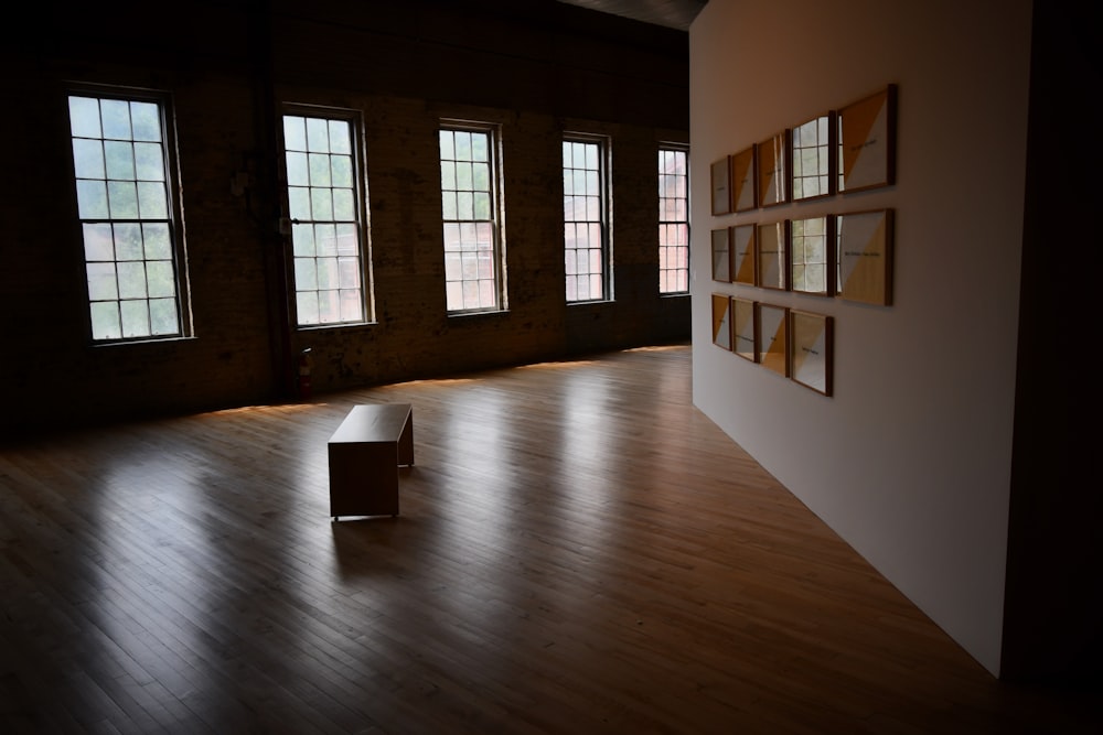 brown wooden floor and white wall