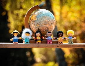 lego mini figures on brown wooden table